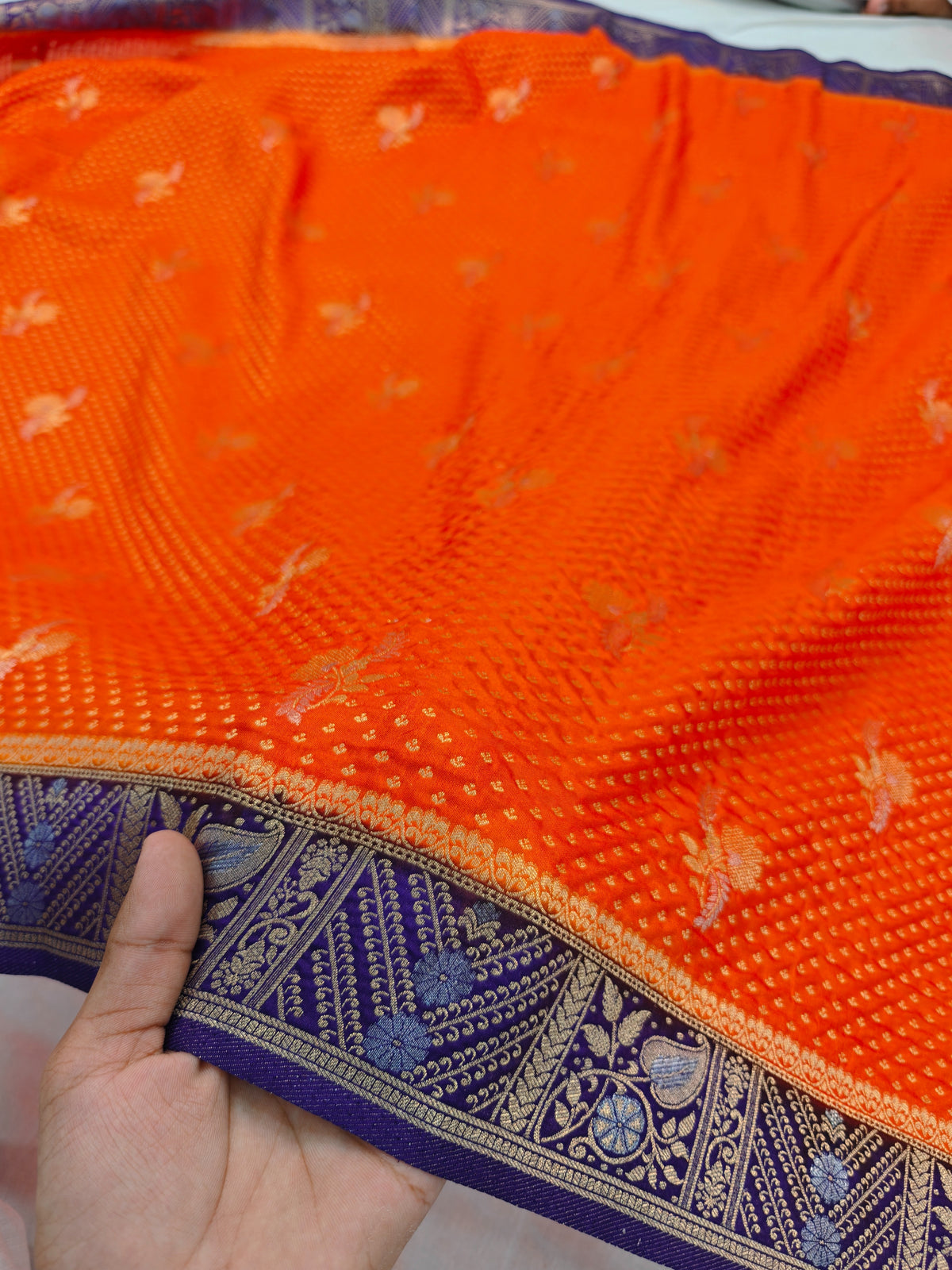 KHADDI GEORGETTE IN TANGY ORANGE WITH INDIGO BORDER