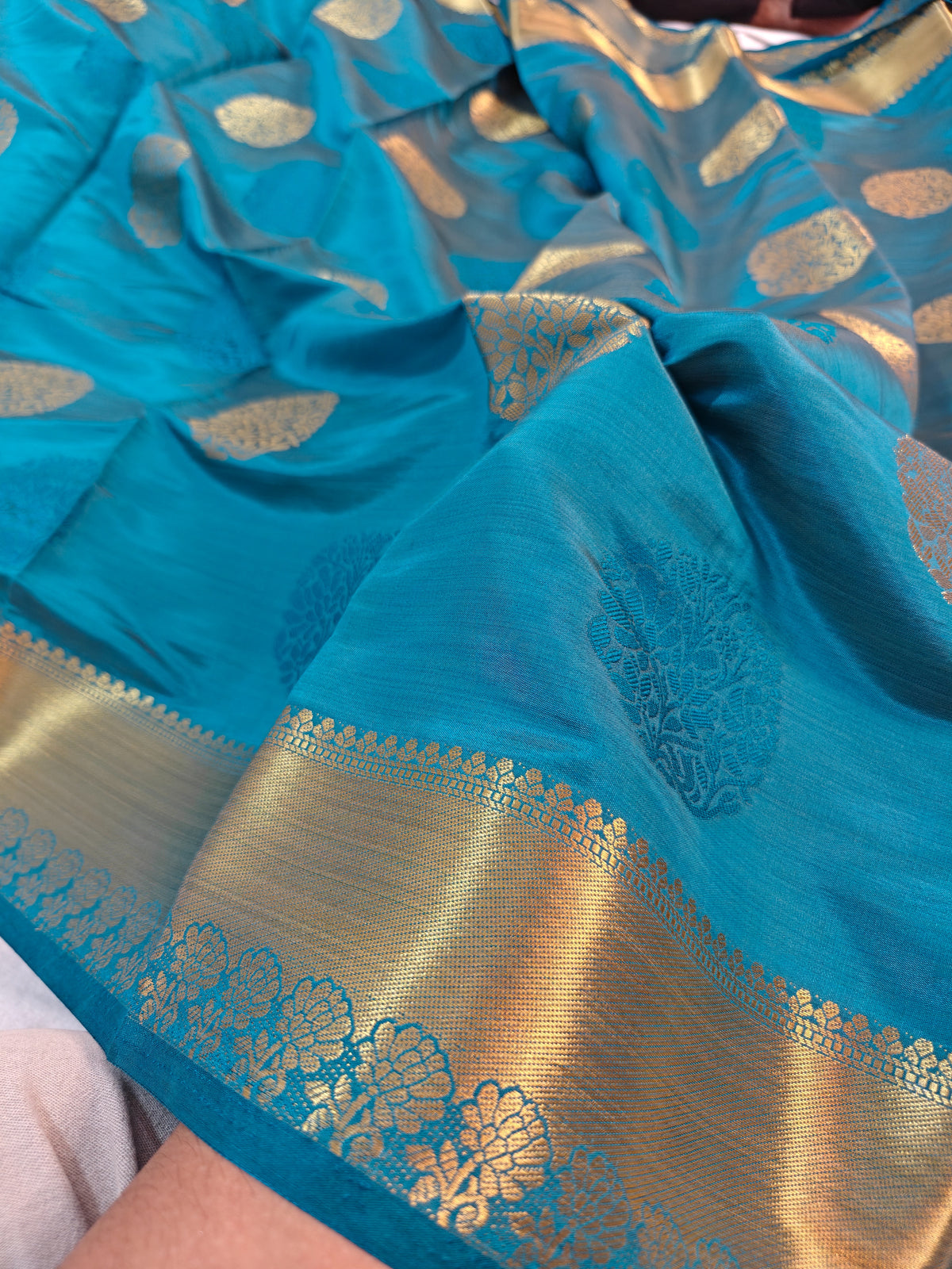 DOLA SILK PEACOCK BLUE WITH GOLDEN ZARI BORDER