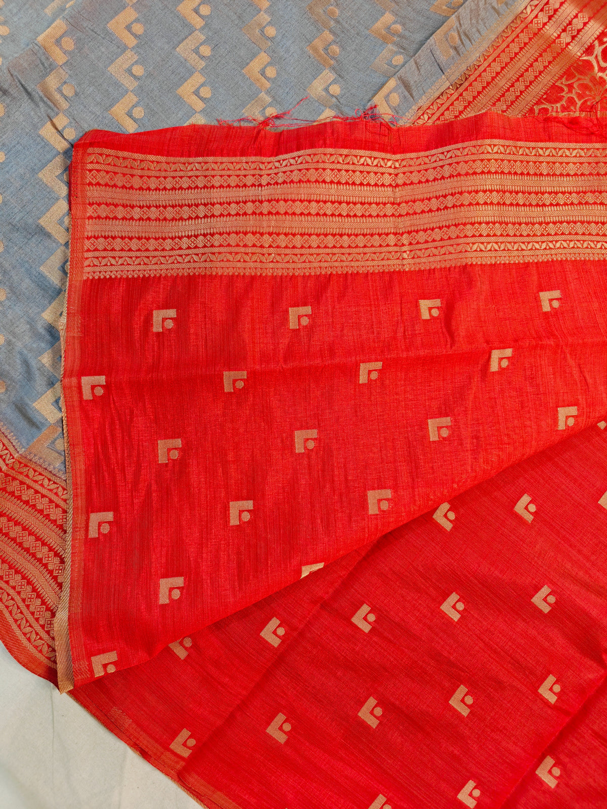 TUSSAR SILK GRAY PAIRED WITH GOLDEN ZARI CORAL-RED BORDER