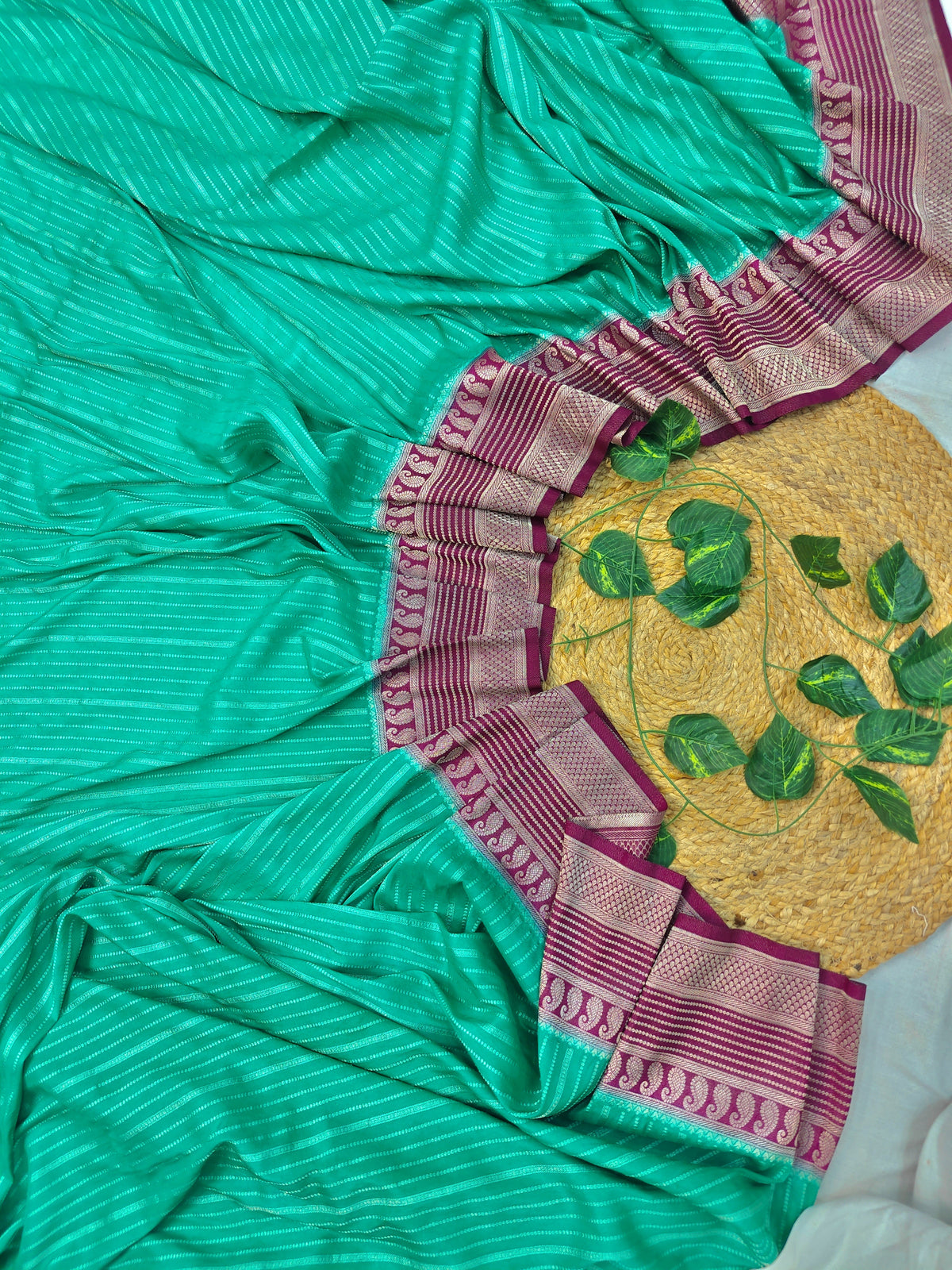 CREEPE GEORGETTE PINE GREEN AND ZARI WORK WITH MAROON BORDER