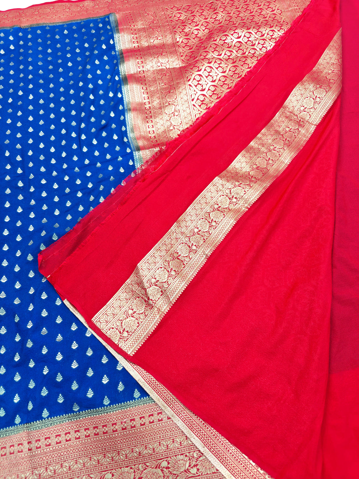 KHADDI GEORGETTE ROYAL BLUE GOLDEN ZARI WORK WITH CHERRY RED BORDER