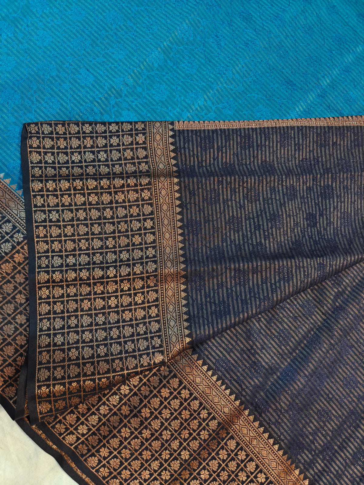 DOLA SILK PEACOCK BLUE WITH GOLD ZARI BLACK BORDER