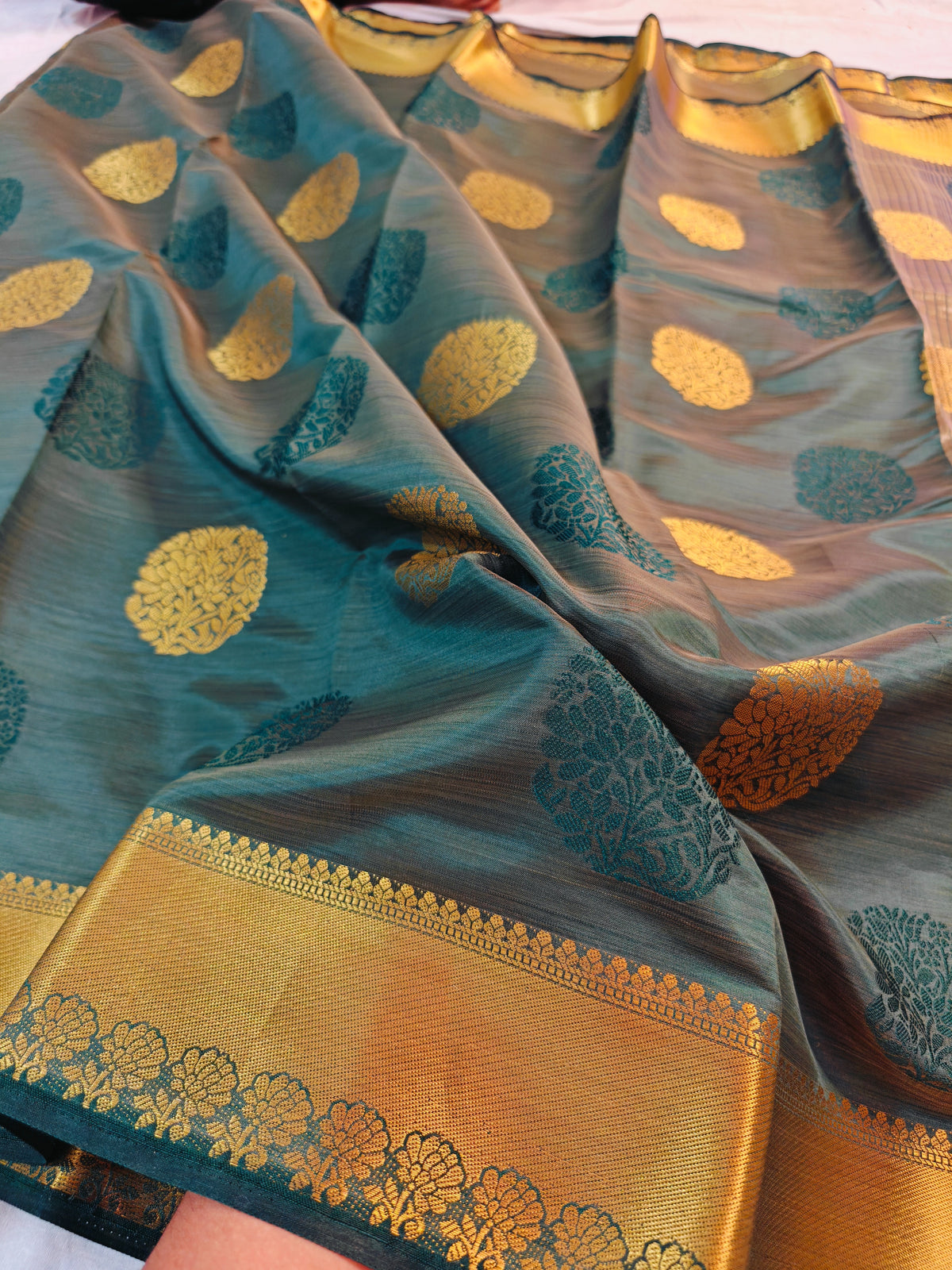 DOLA SILK PEACOCK TEAL BLUE WITH GOLDEN ZARI BORDER
