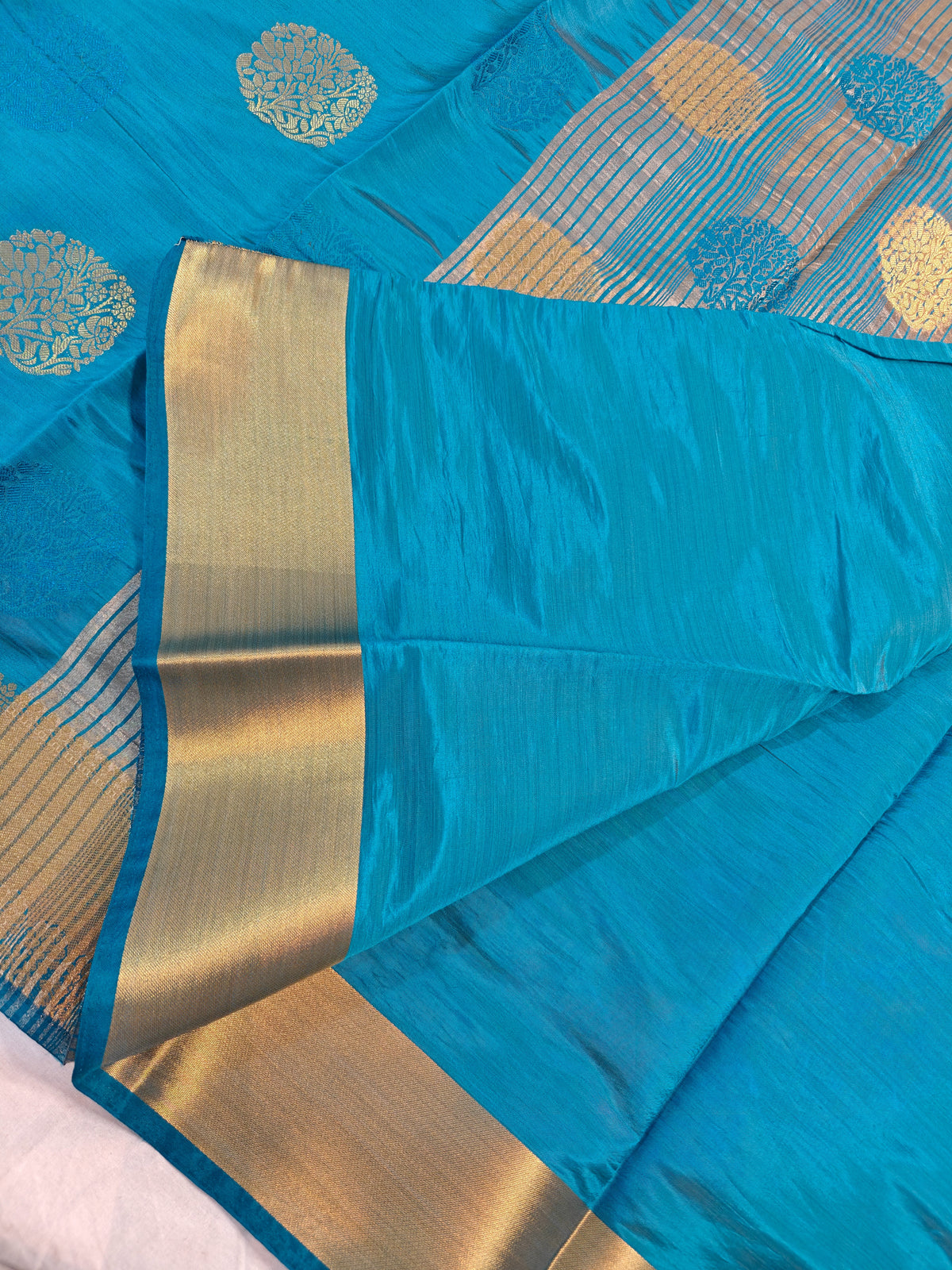 DOLA SILK PEACOCK BLUE WITH GOLDEN ZARI BORDER