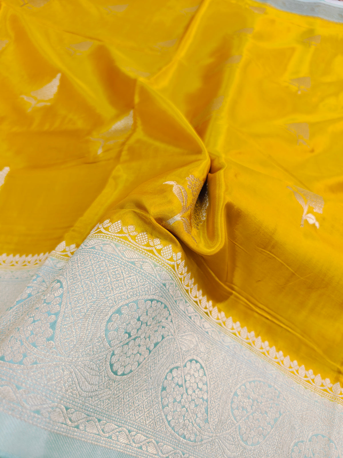 KOREAN SILK YELLOW WITH SKY BLUE AND GOLDEN ZARI BORDER