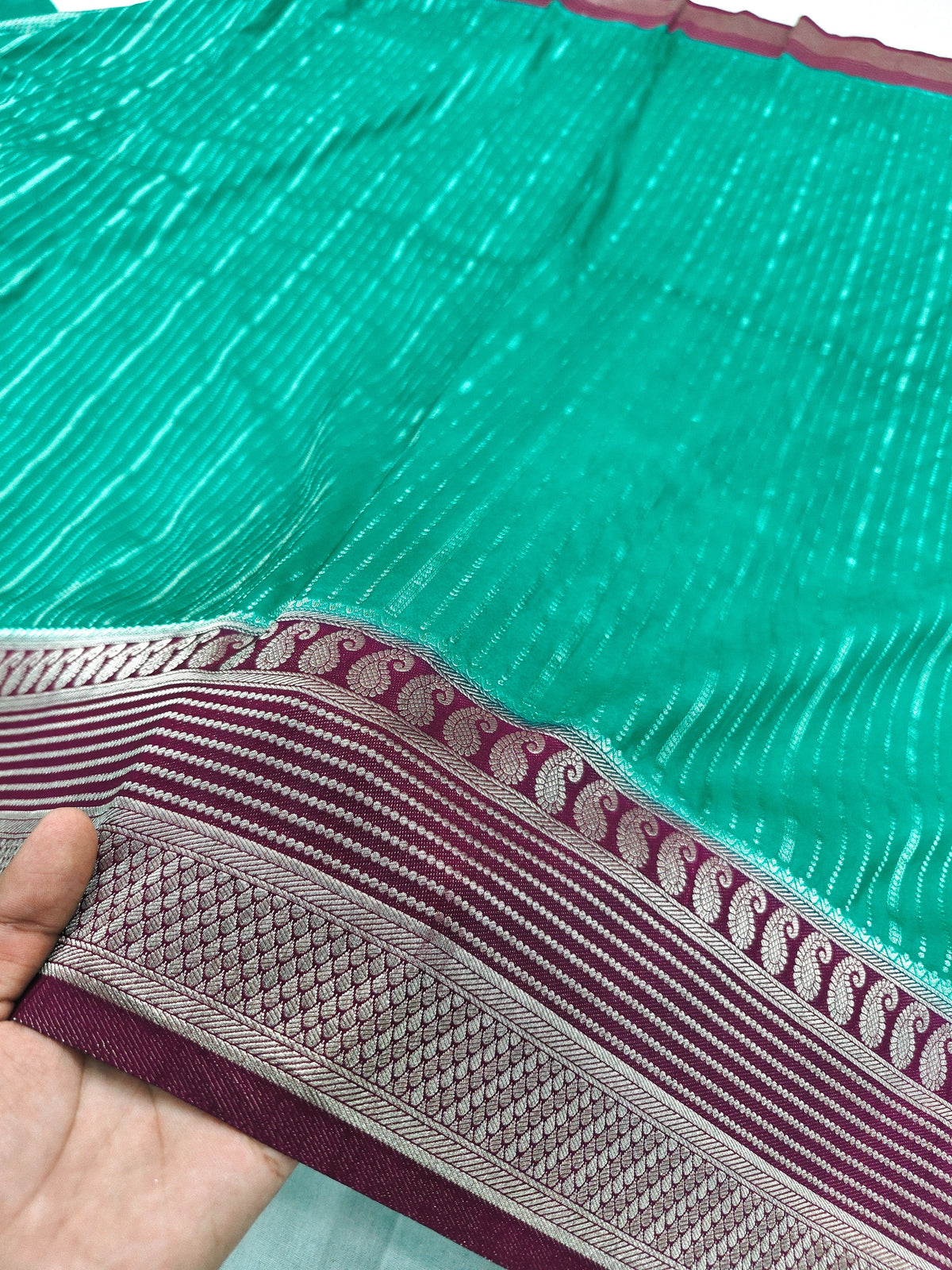 CREEPE GEORGETTE PINE GREEN AND ZARI WORK WITH MAROON BORDER